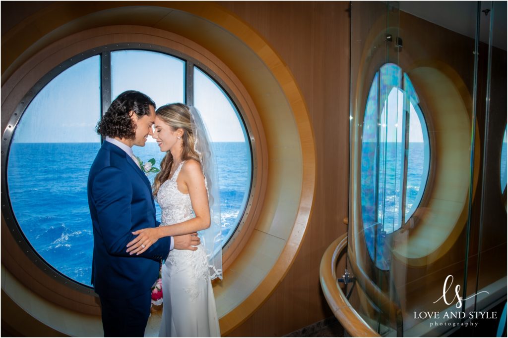 Daisy and Nenad's cruise ship wedding in front of the porthole