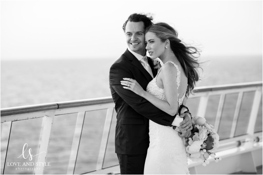 Daisy and Nenad's cruise ship wedding, bride and groom on the deck at sunset