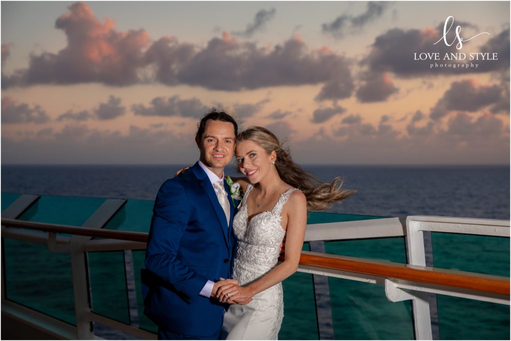 Daisy and Nenad's cruise ship wedding, bride and groom on the deck at sunset