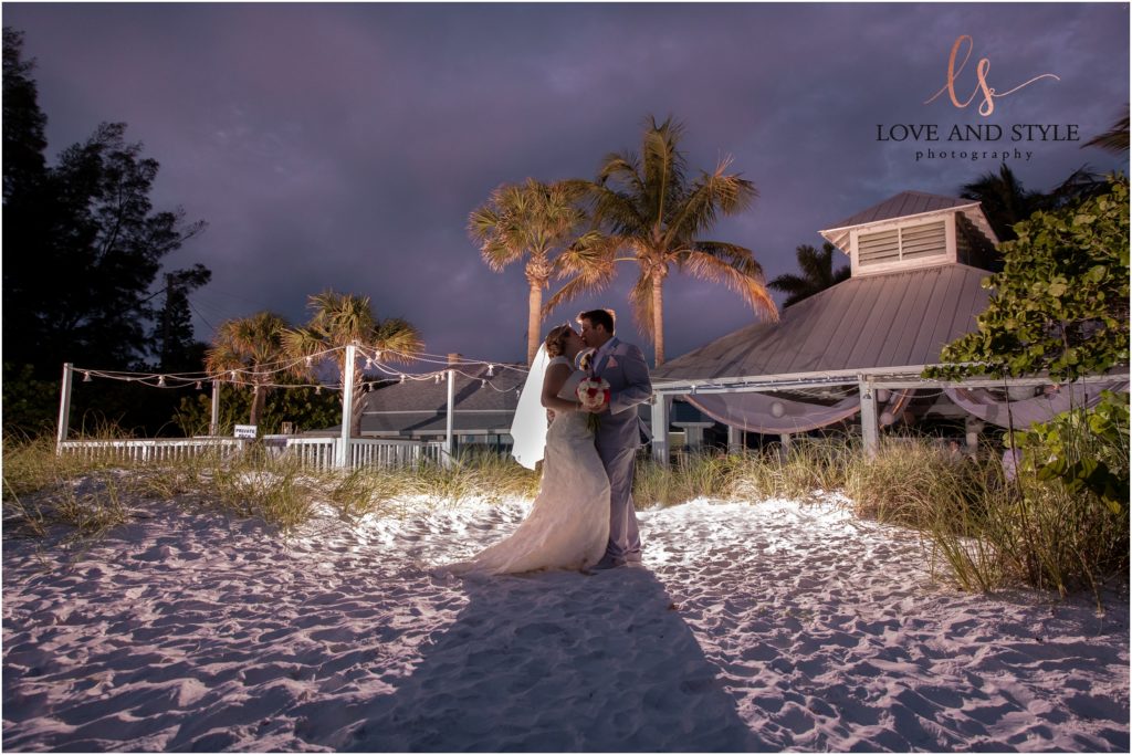 Anna Maria Island Wedding Photography at The Sandbar Restaurant, bride and groom backlit with the sunset.