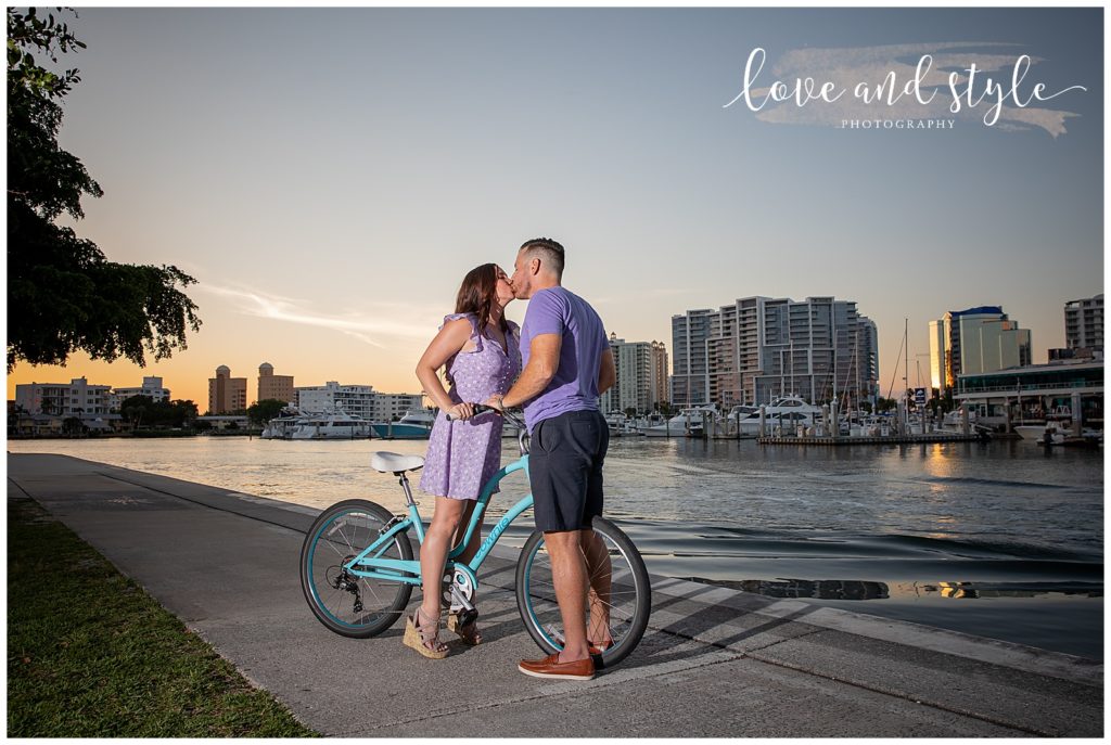 Engagement Photography in Sarasota, Fl at Bayfront Park, couple on a blue bike