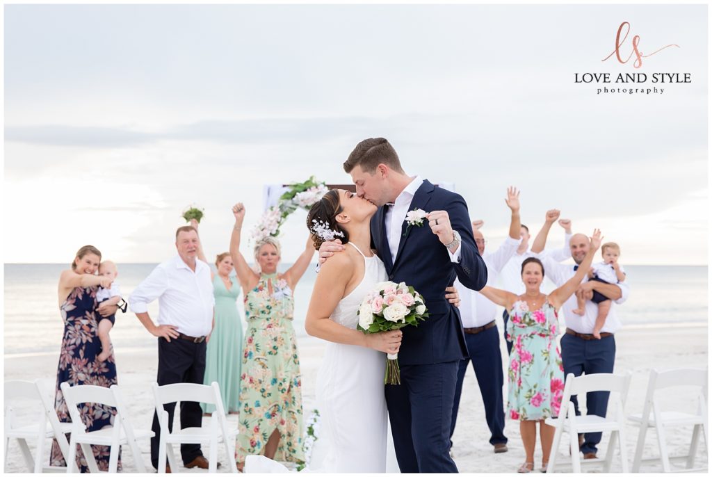 Bride and Groom kissing on their Anna Maria Island Sunset Beach Wedding day