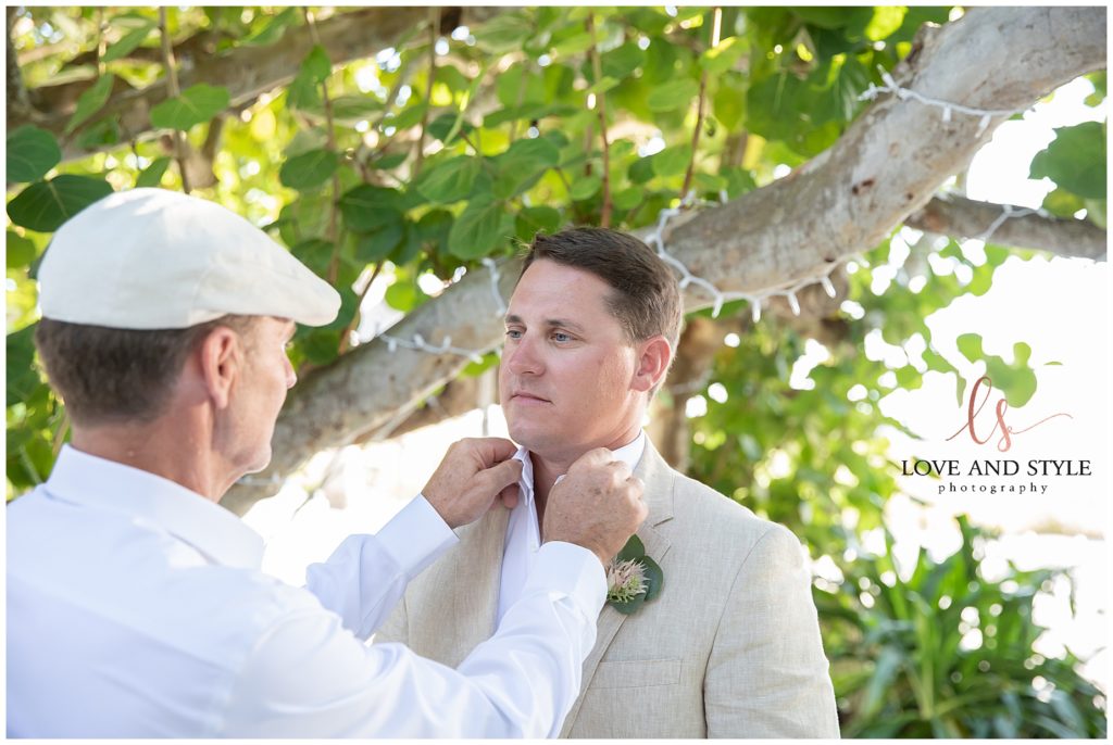 Groom getting ready with his father on Anna Maria Island