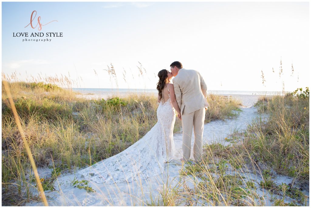 Bride and groom walking out to the beach after Intimate Anna Maria Island Wedding ceremony