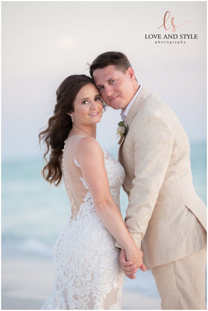 Bride and groom on the beach for thier Intimate Anna Maria Island Wedding