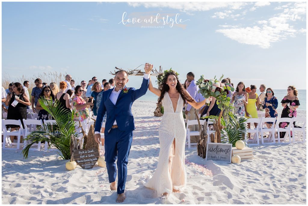 Bride and Groom walking up the aisle at the end of their Wedding on Anna Maria Island