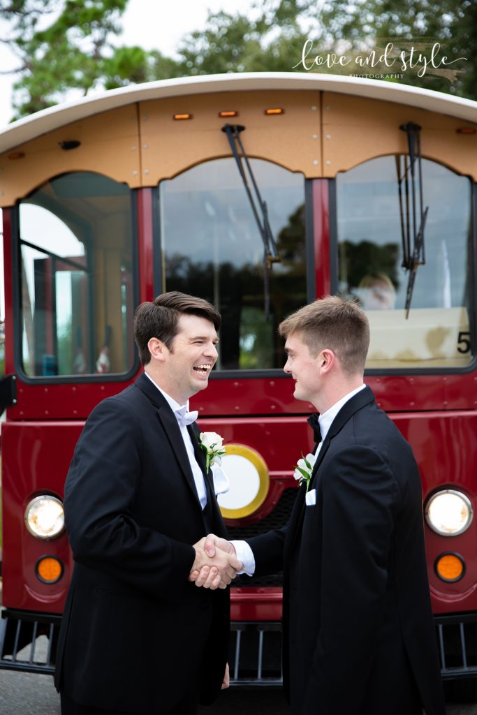Groom shaking hands with his best man before his Gorgeous Sarasota Wedding