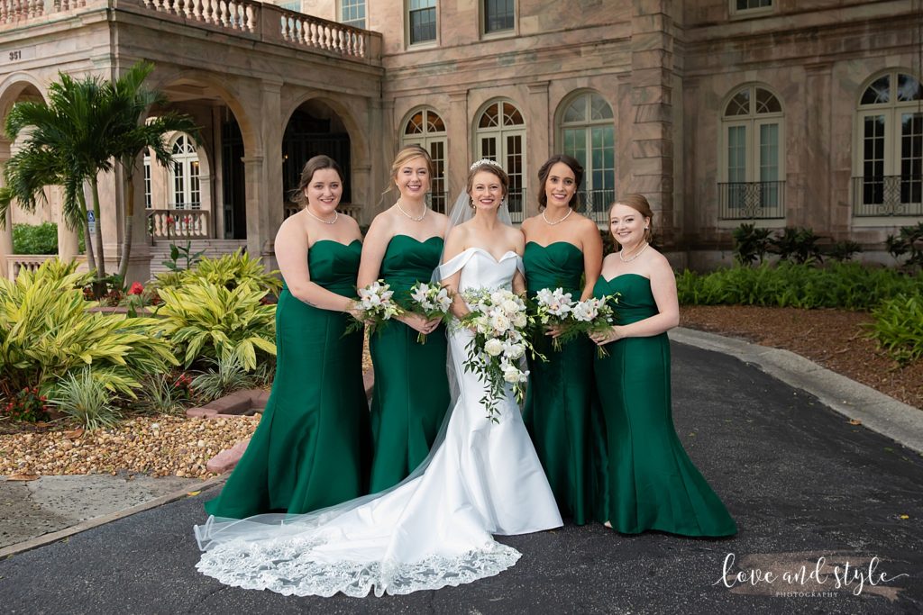 Bride with her bridesmaids in front of the New College for a Gorgeous Sarasota Wedding