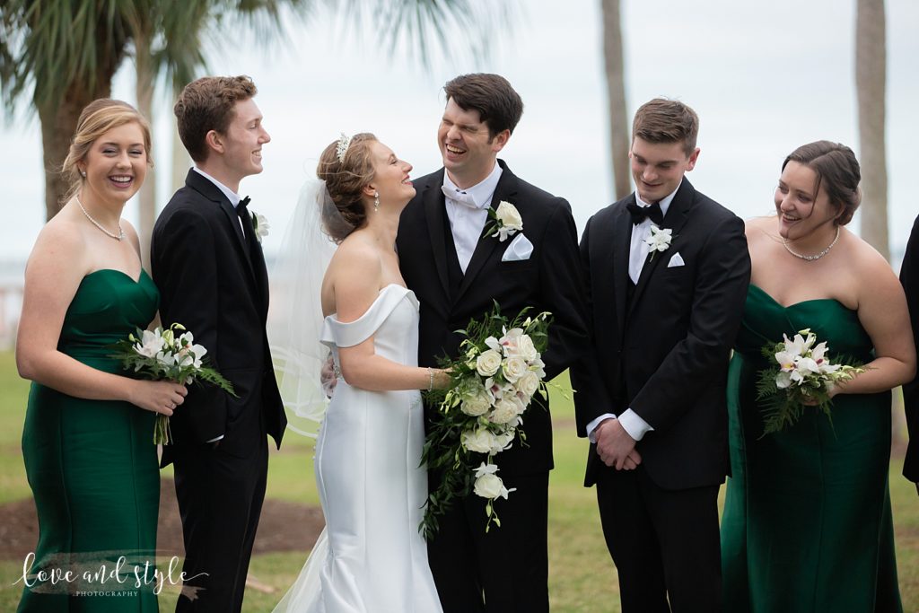 Bride and Groom giggling between formal pictures on the grounds of the New College of Sarasota campus