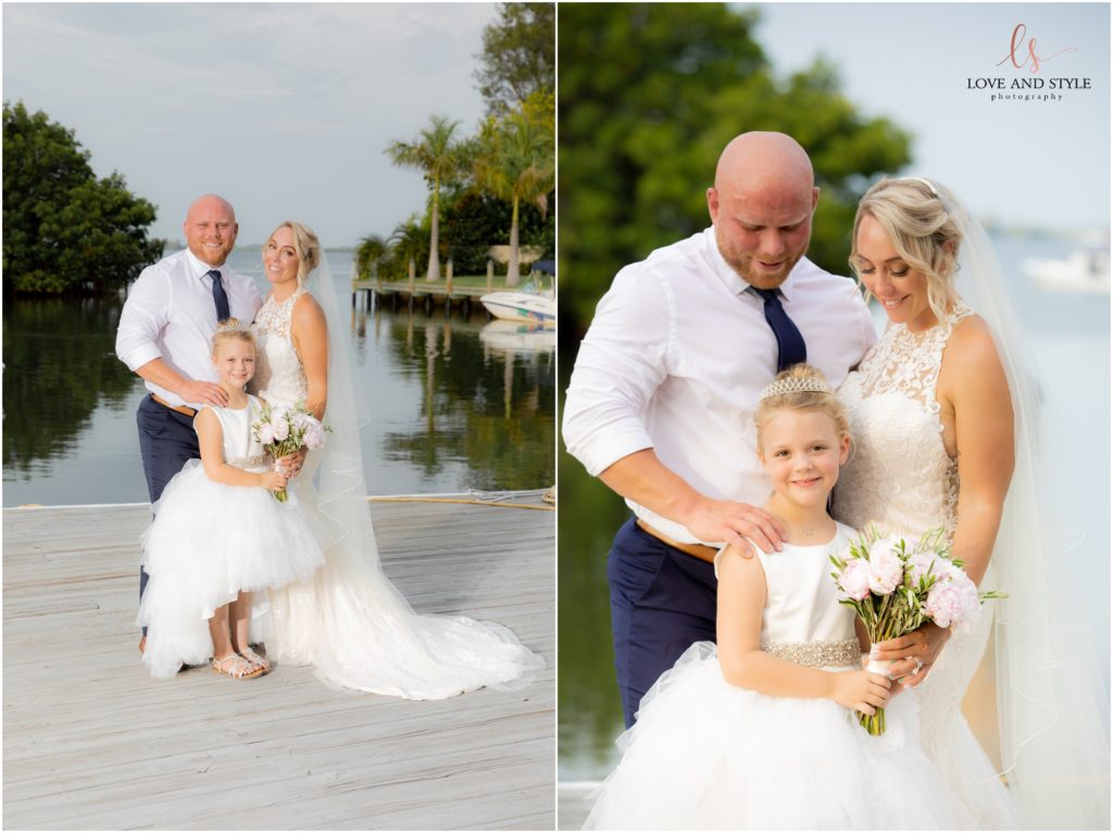 Bride and groom with their flower girl at The Waterline Resort and Marina on Anna Maria Island