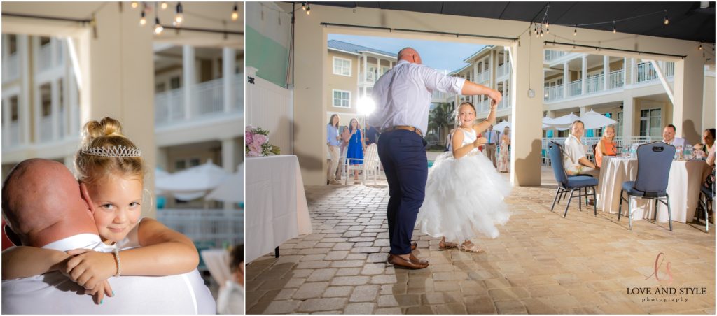 Groom dancing with his flower girl and daughter and The Waterline Resort on Anna Maria Island