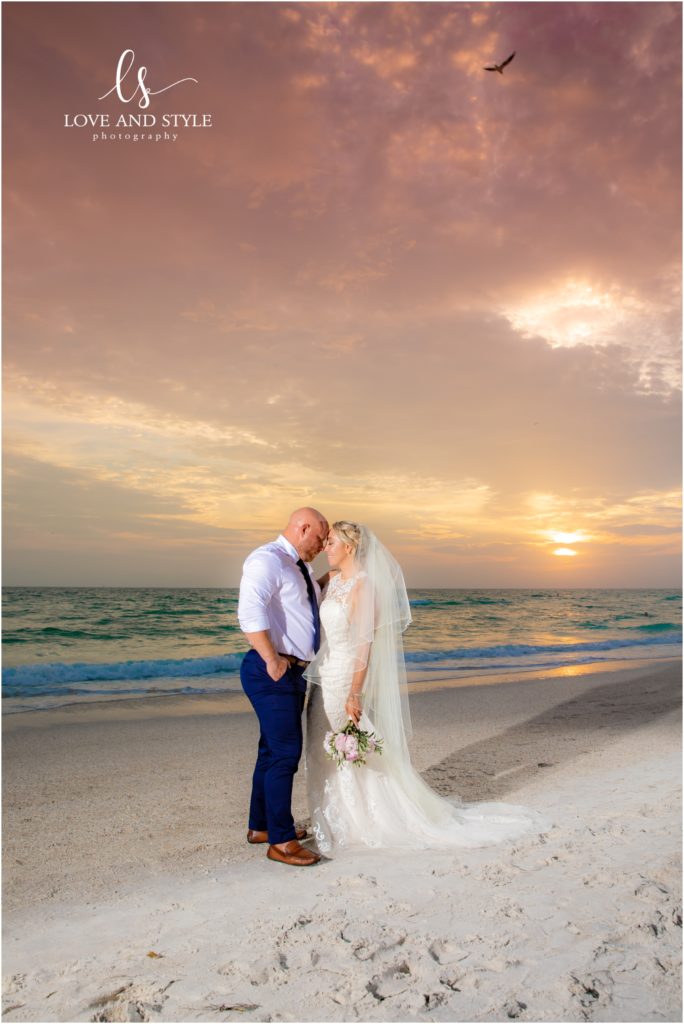 Bride and groom on an Anna Maria Island Beach at sunset