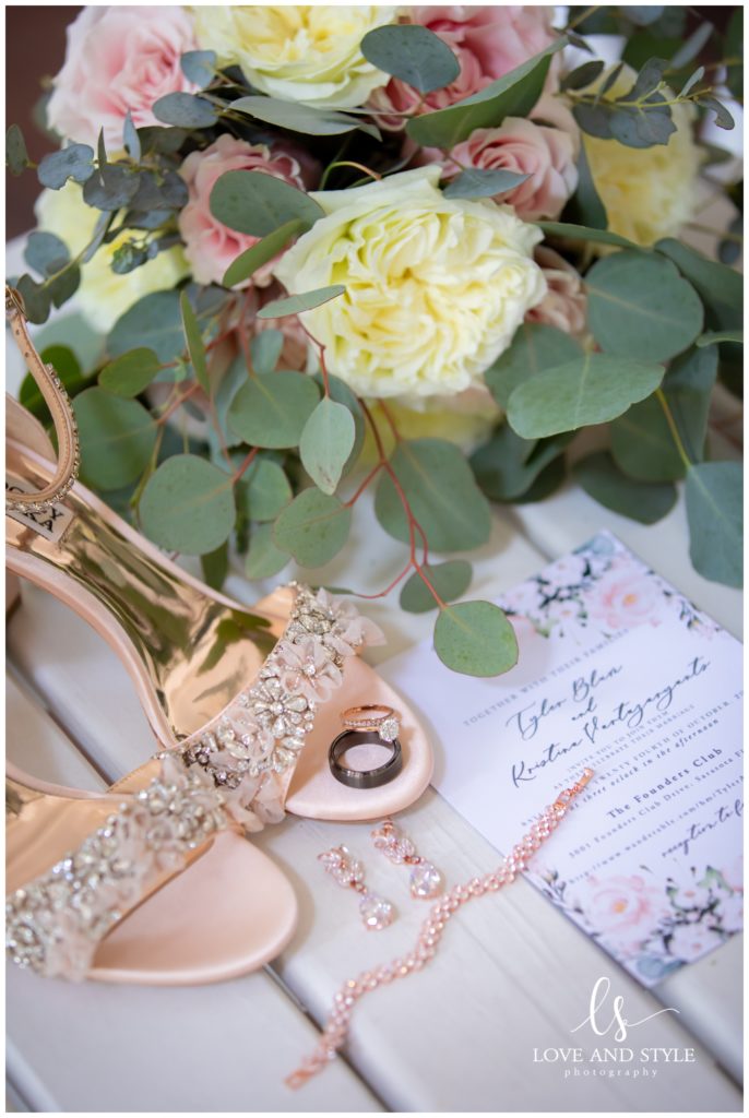 Detail shot of theWedding details with the rings and flowers by Sarasota Wedding Photographer