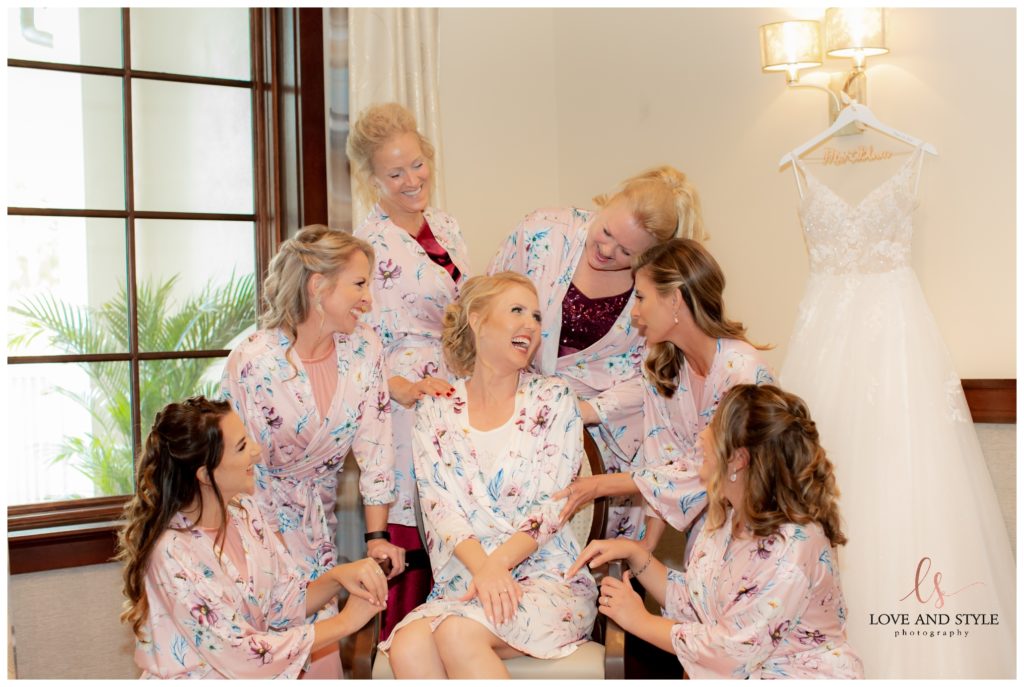 Bride getting ready with her bridesmaids at The Founders Club in Sarasota, Florida