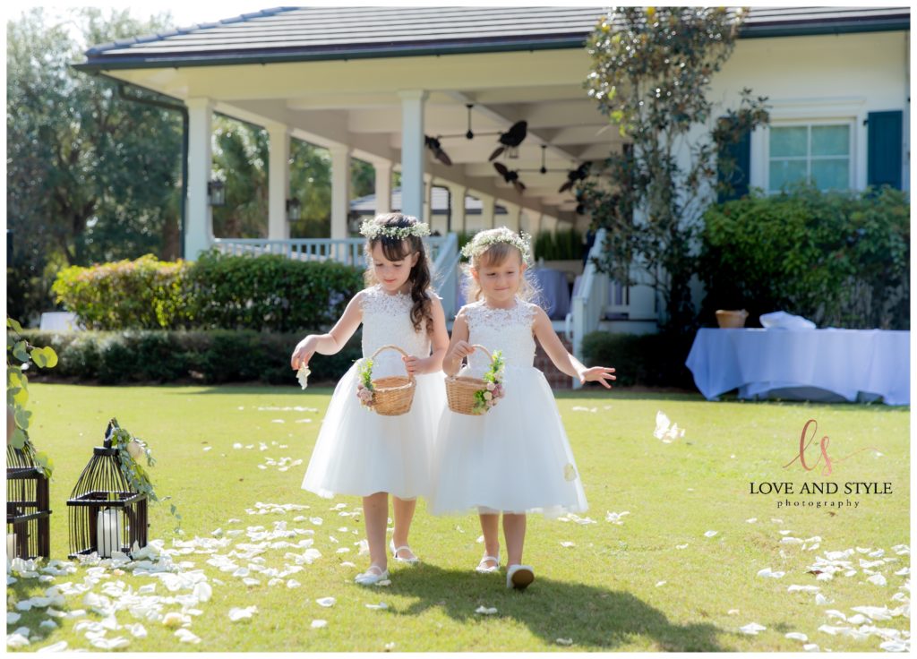 Flower girls walking down the aisle at Sarasota Wedding at The Founders Club