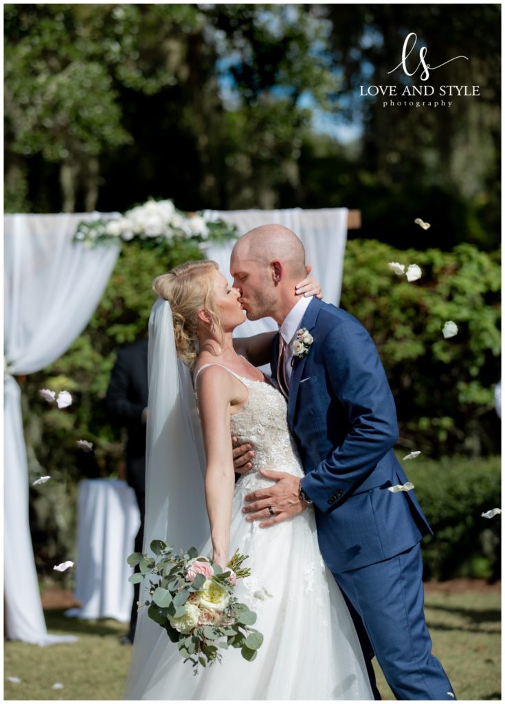 Bride and Groom first kiss at Sarasota Wedding at The Founders Club