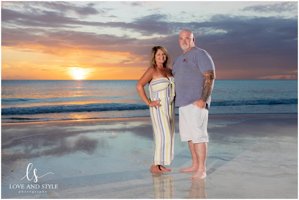 A couples picture at sunset on the beach of Anna Maria Island