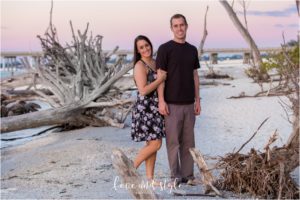 Engaged couple at sunset on Beer Can Island