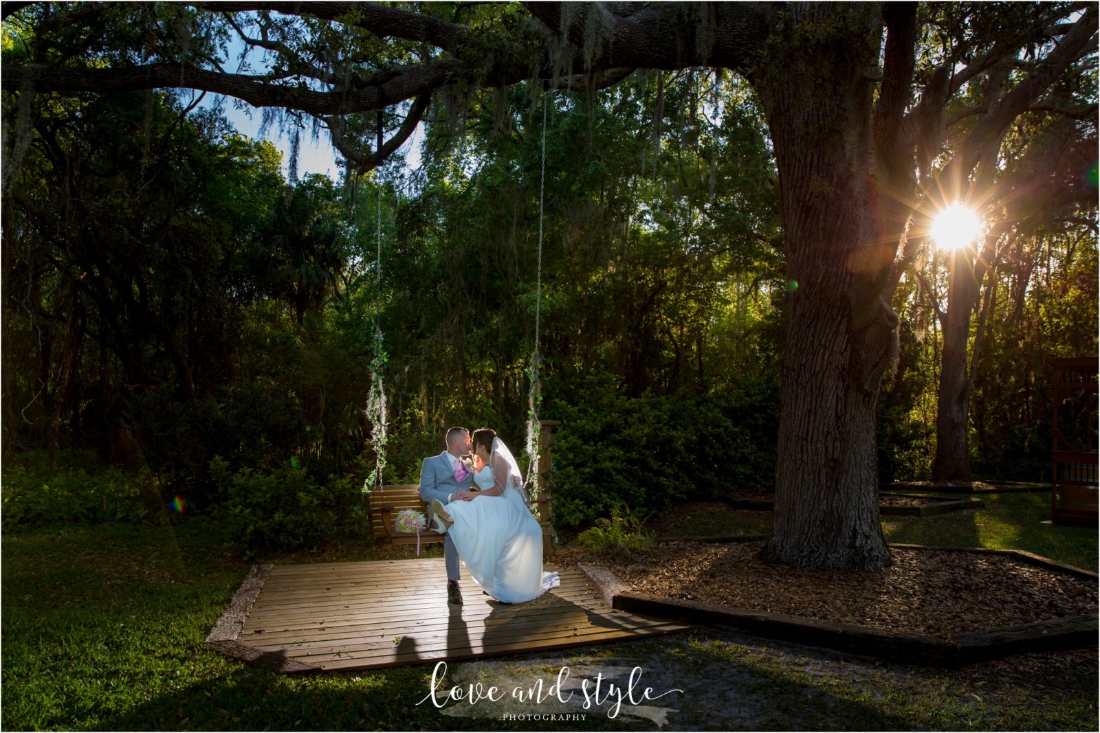 Bakers Ranch Wedding bride and groom on a tree swing at sunset