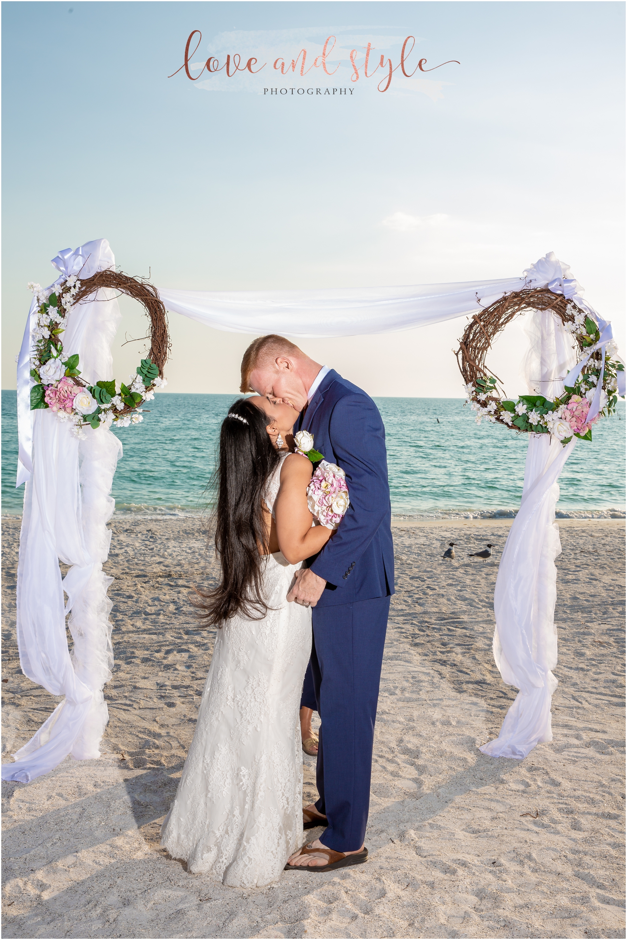 Holmes Beach Wedding of bride and groom kissing at the end of the ceremony