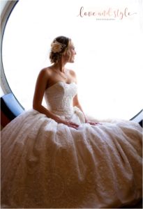 Disney Dream Cruise Wedding Photography of bride siting in the porthole with backlight