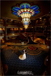 Disney Dream Cruise Wedding Photography, bride and groom kissing backlit in the atrium