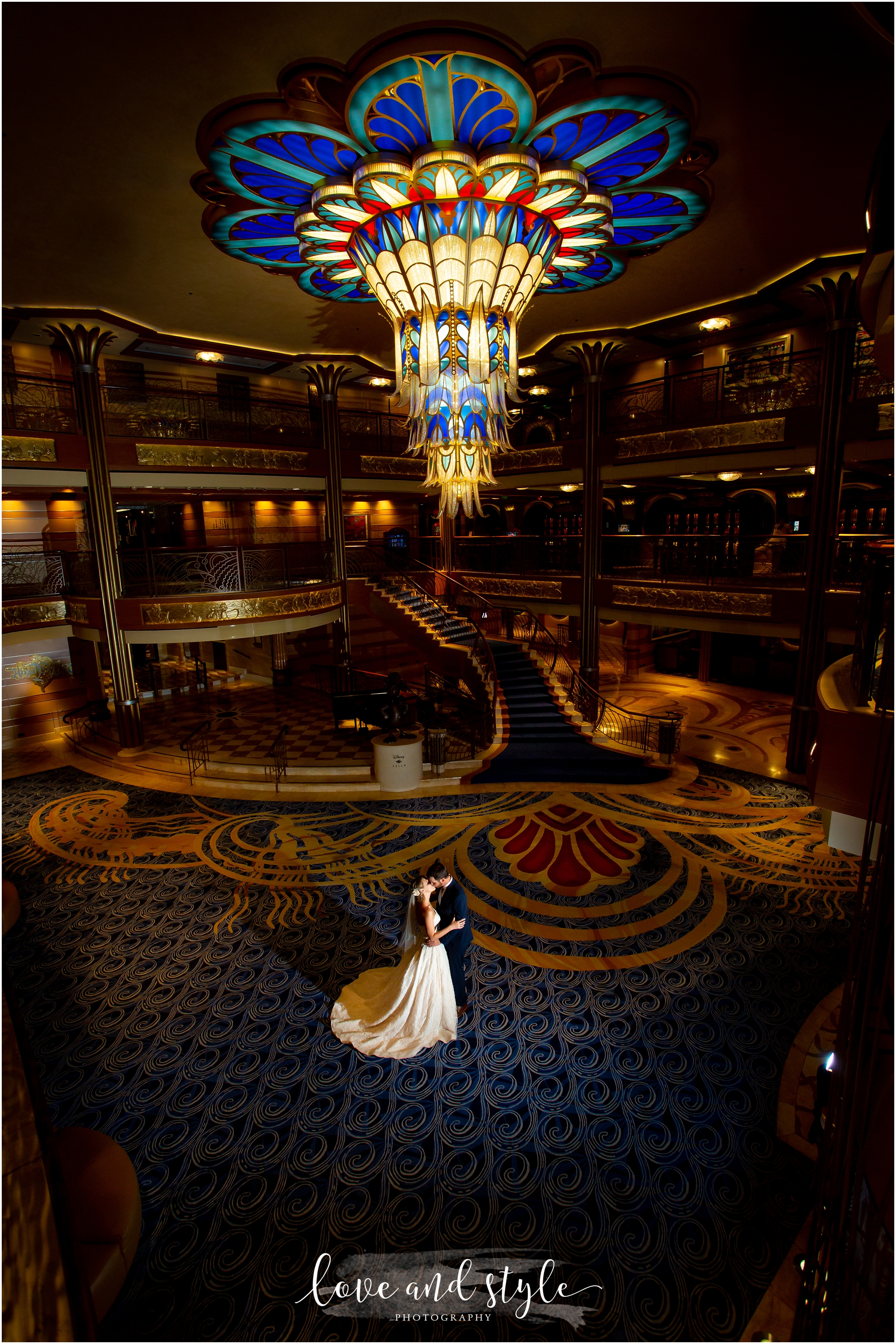 Disney Dream Cruise Wedding Photography, bride and groom kissing backlit in the atrium