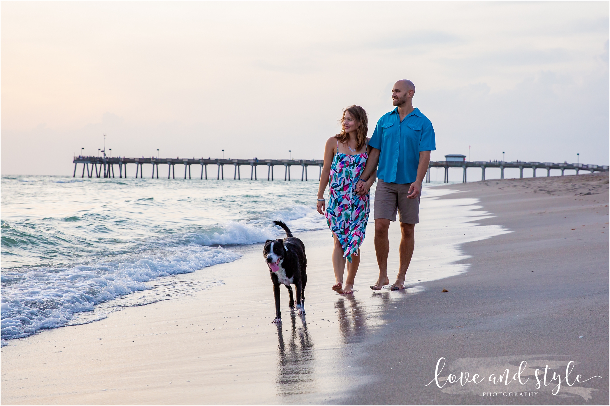 Venice Dog Beach Engagement photo with couple and their black and white dog at sunset
