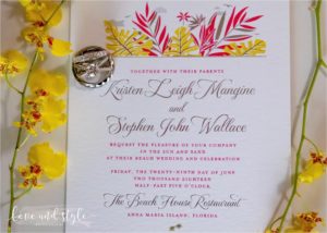 beach house wedding invitation with the rings detail shot
