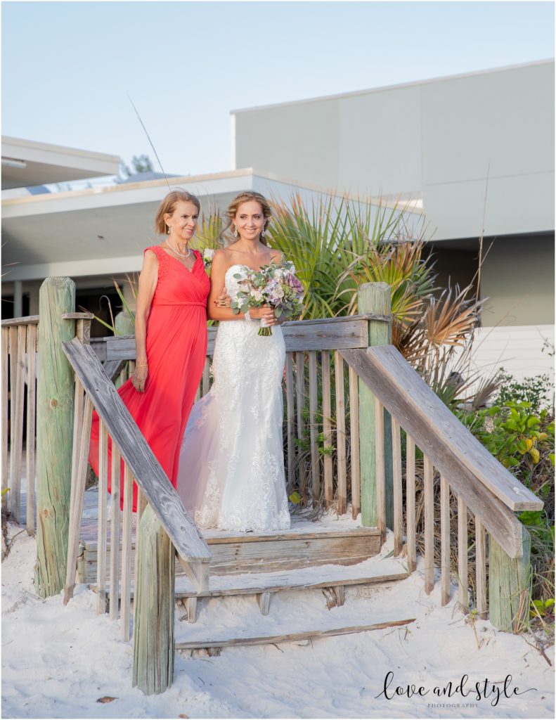 A Wedding at The Beach House on Anna Maria Island, bride and mom walk down the aisle