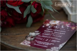 Sarasota Wedding Photographer at The Barn at Chapel Creek photo of the rings on the invitation