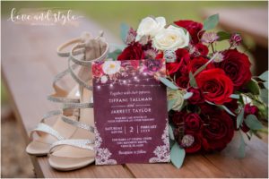 Sarasota Wedding Photographer at The Barn at Chapel Creek Detail shot of the invitation, shoes, and flowers