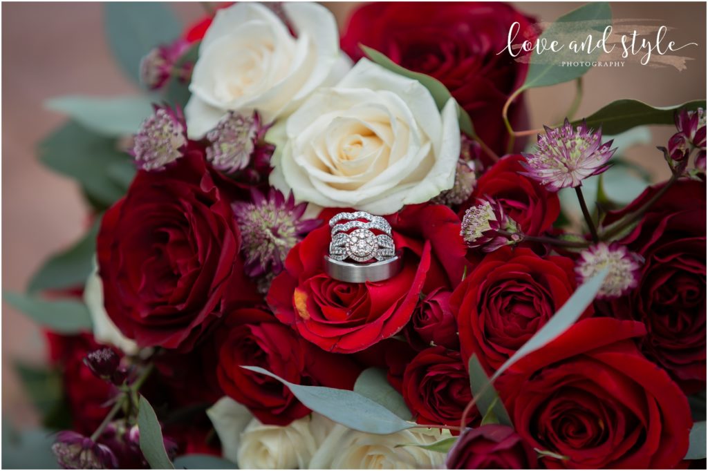 Sarasota Wedding Photographer at The Barn at Chapel Creek close up photo of the wedding rings in the bouquet