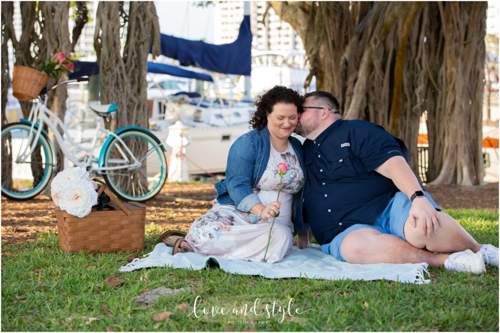 Engagement Photographer Sarasota with couple having a picnic under a tree
