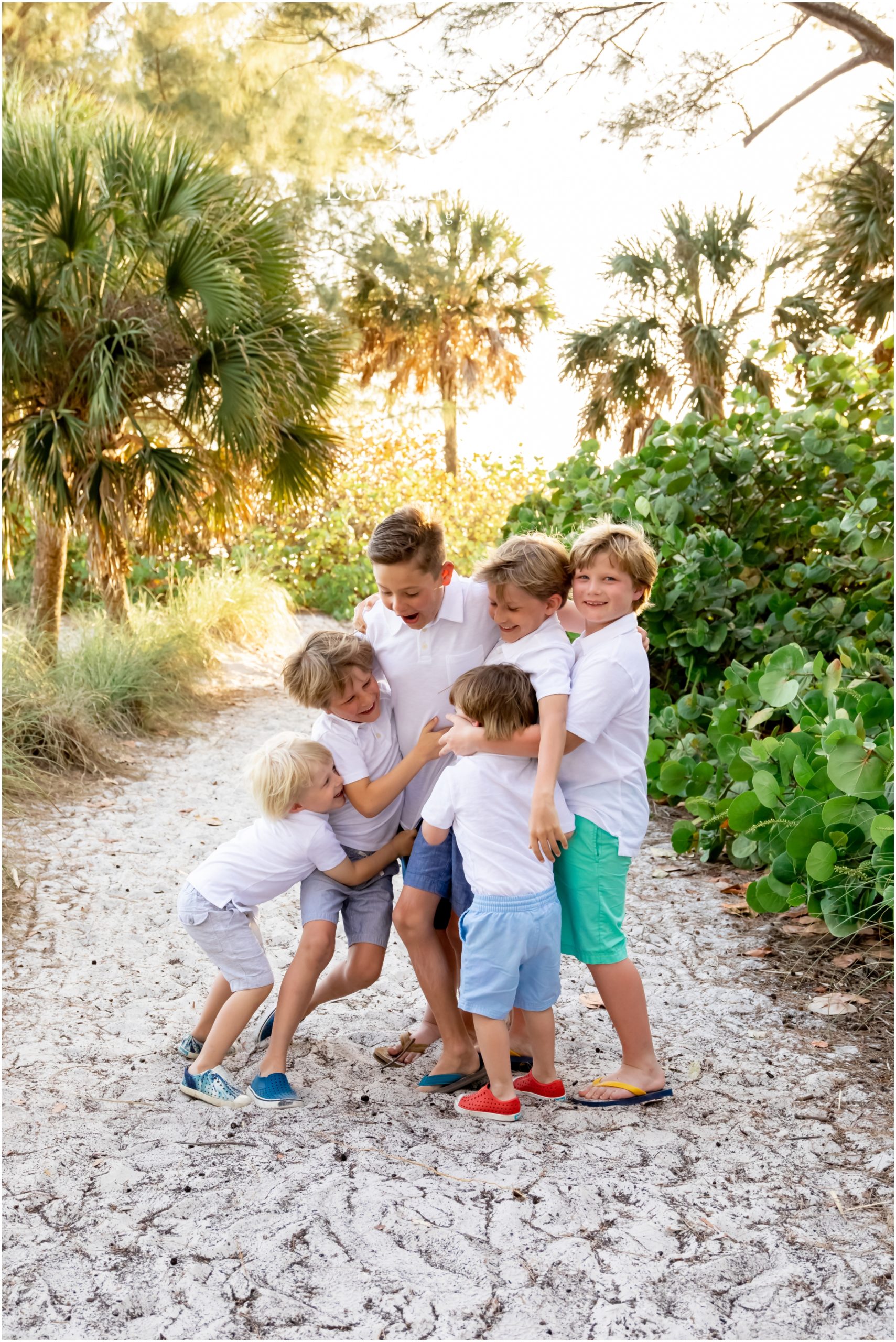 Family Photographer Anna Maria Island of 6 boy cousins playing
