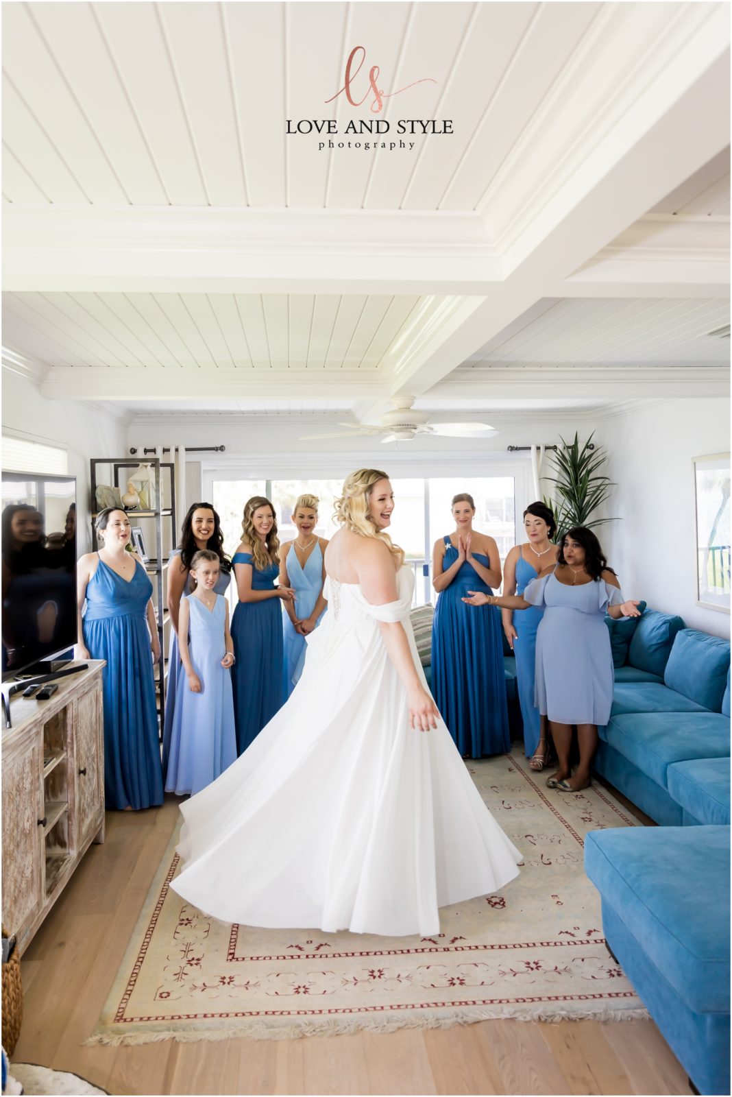 Bride twirling in front of her bridesmaids before her Wedding Selby Gardens Sarasota
