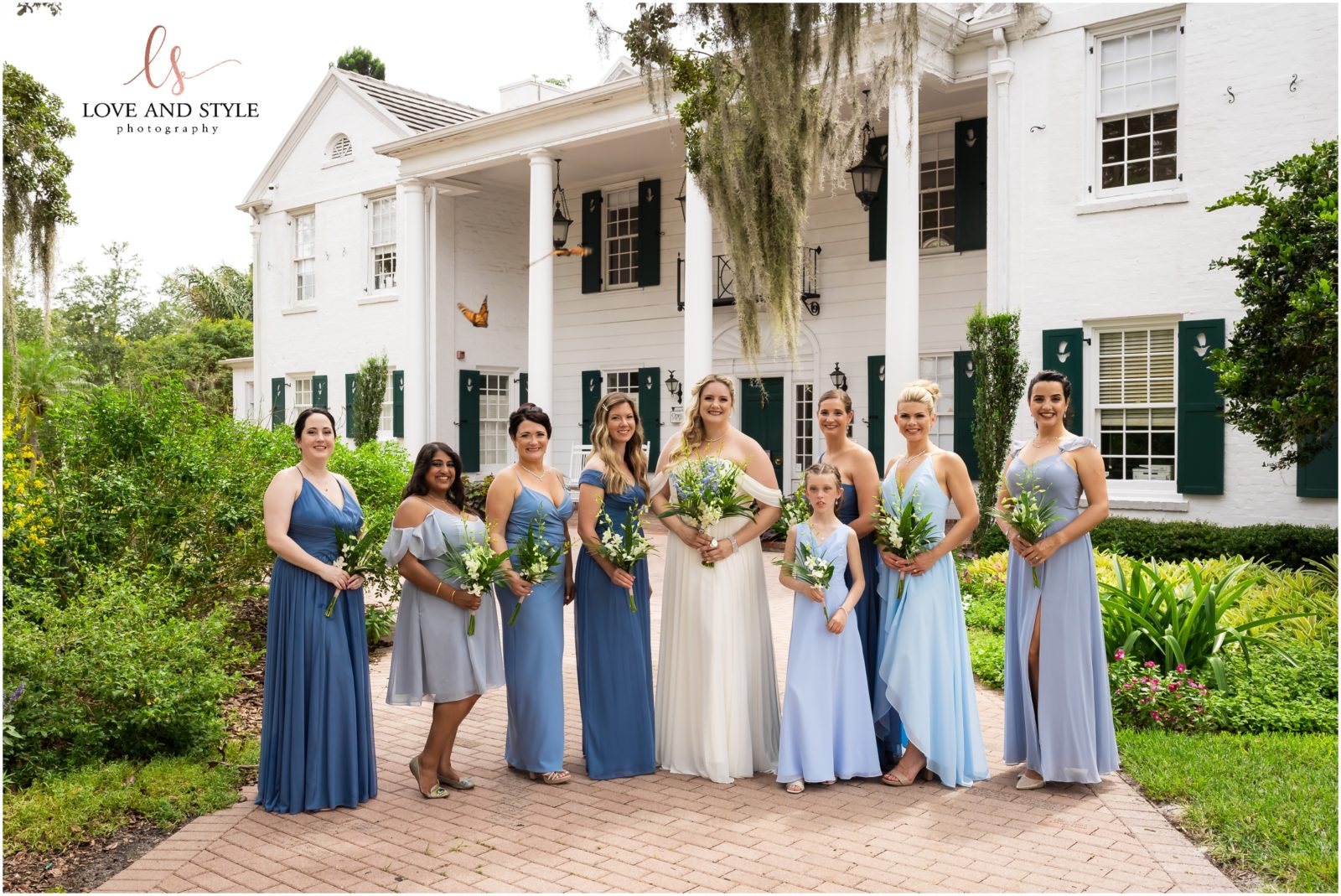 Bride and Bridesmaids in the butterfly garden on the grounds of Marie Selby Botanical Gardens