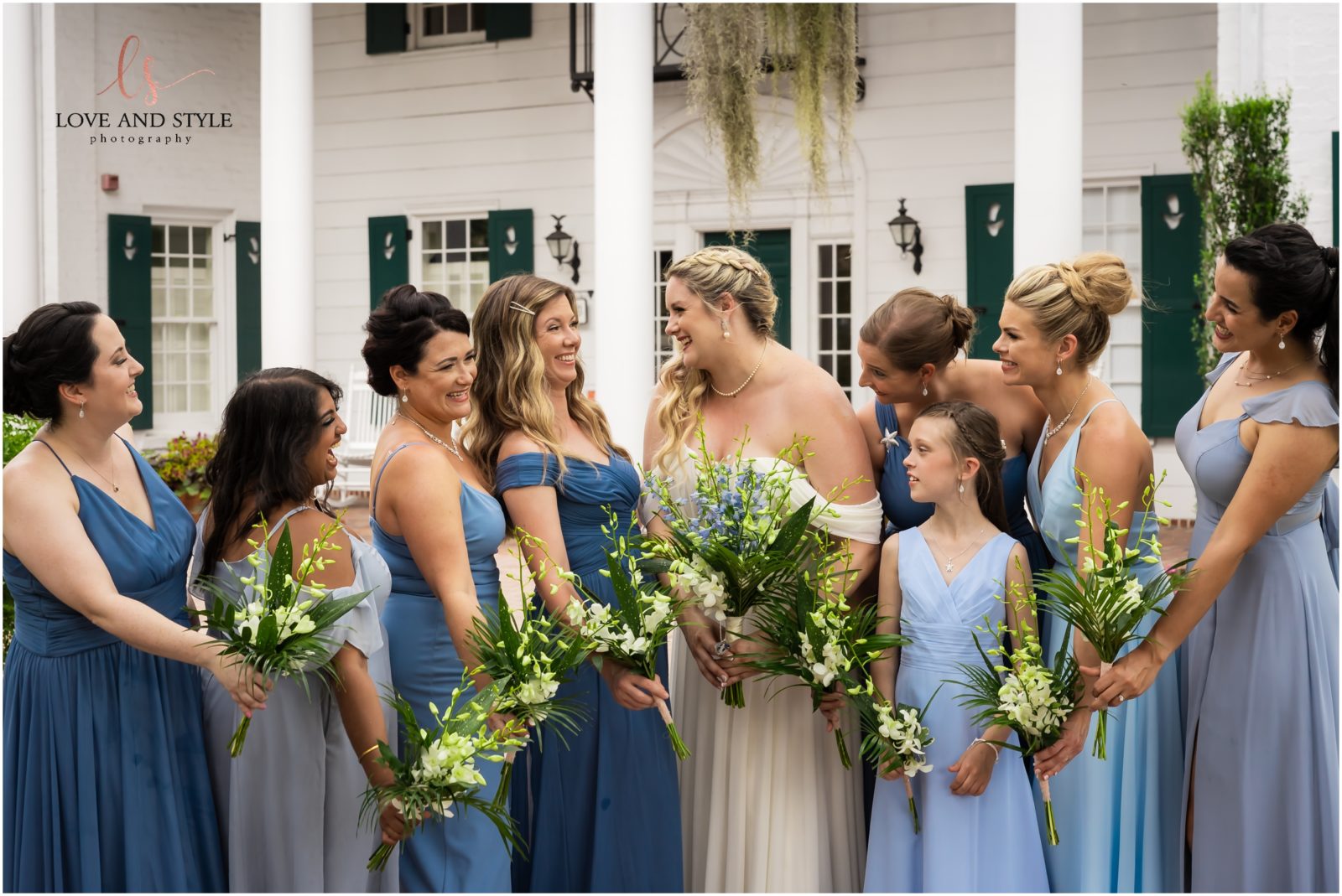 Bride and Bridesmaids in the butterfly garden on the grounds of Marie Selby Botanical Gardens