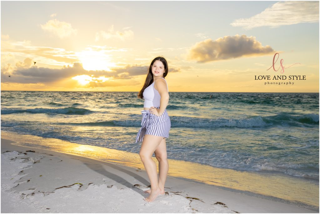 A sunset beach background for a teenage girl by the water