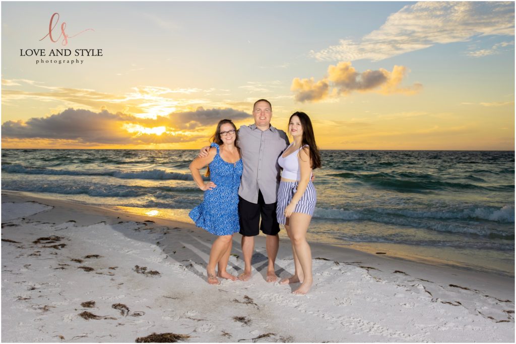 A family photo by Family Photographer on Anna Maria Island on the beach at sunset