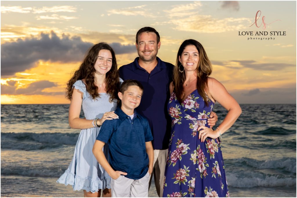 A family photo by Family Photographer on Anna Maria Island on the beach at sunset