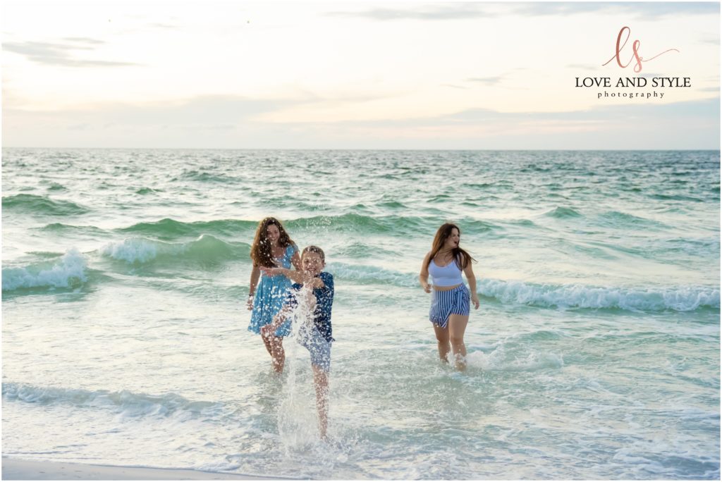 Kids running in the water by Family Photographer on Anna Maria Island