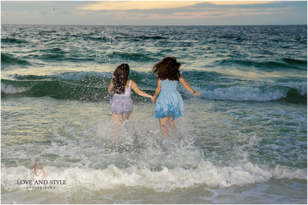 Kids running into the water on Anna Maria Island