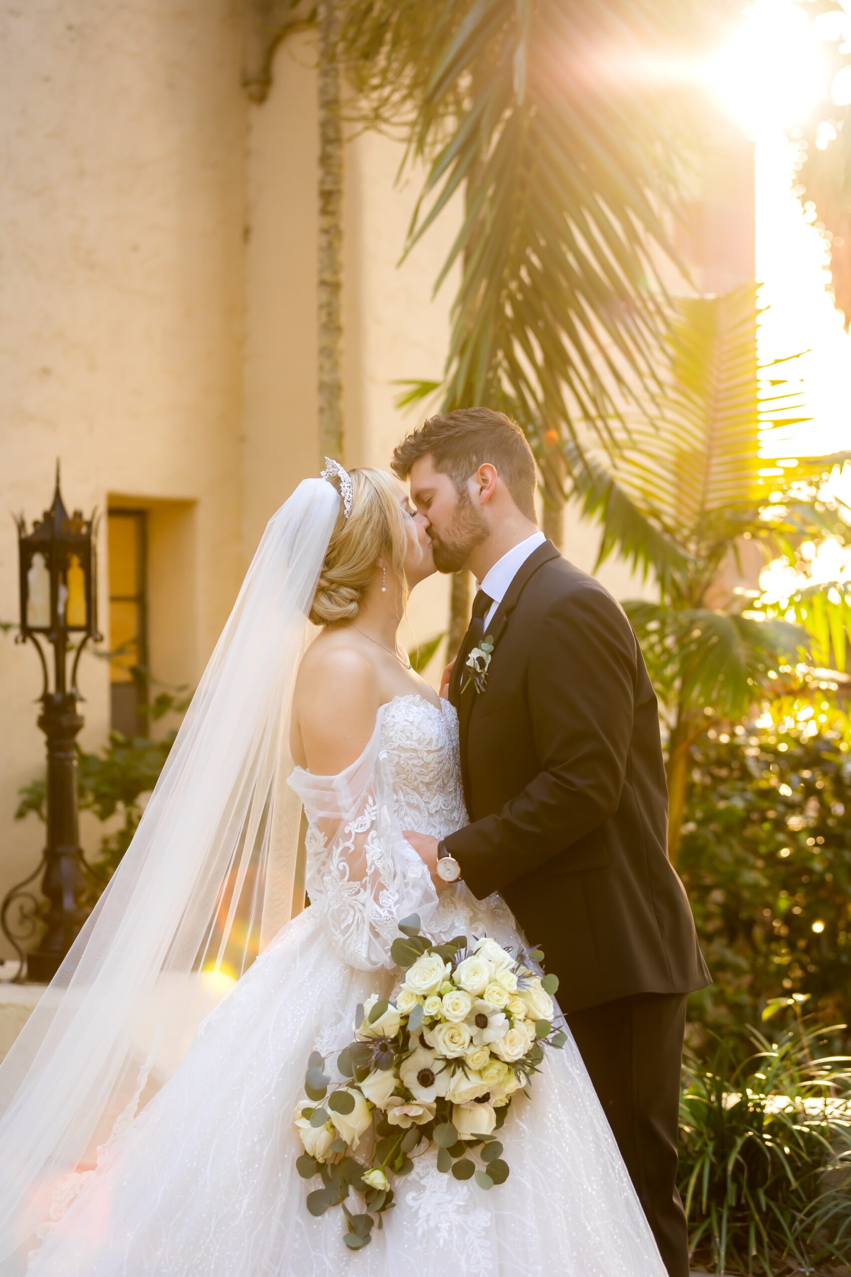 Bride and groom, Morgan and Ethan, kissing during sunset at the Powel Crosley Estate.