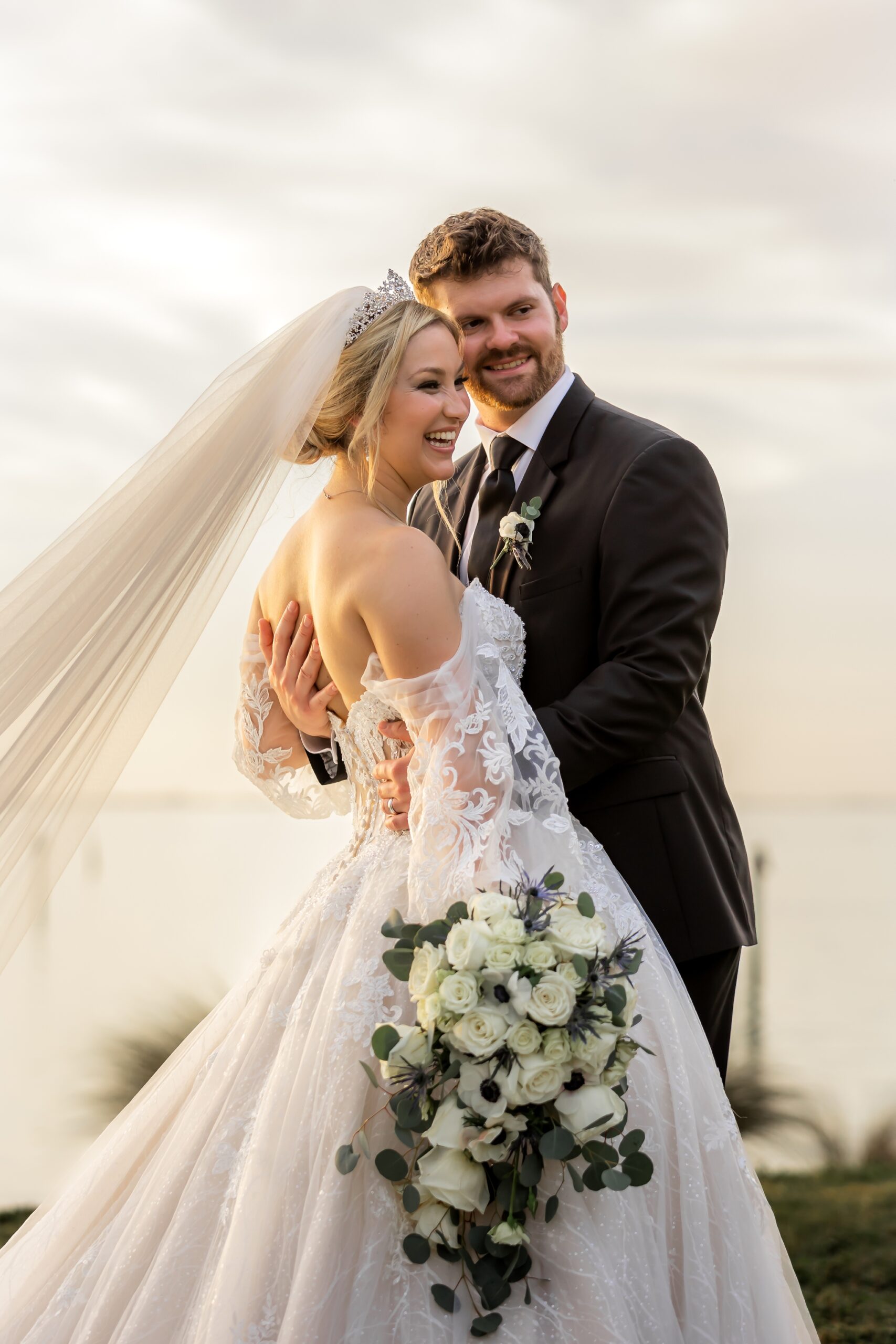 Candid shot of bride and groom, Ethan and Morgan, smiling and laughing after their ceremony at the Powel Crosley Estate in Sarasota.