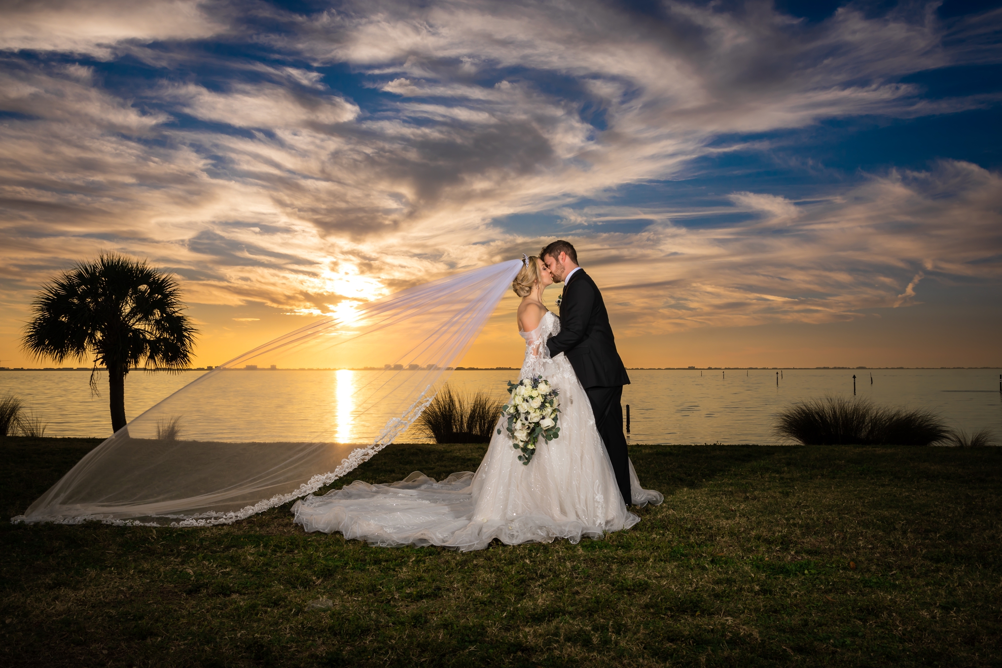 Wide angle sunset photo of bride and groom, Ethan and Morgan, at their Powel Crosley Estate Wedding taken by Love and Style Photography. 