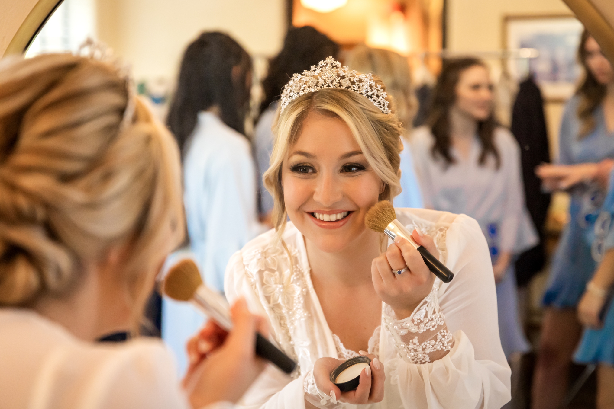 Bride, Morgan, touching up her makeup before her ceremony at The Powel Crosley