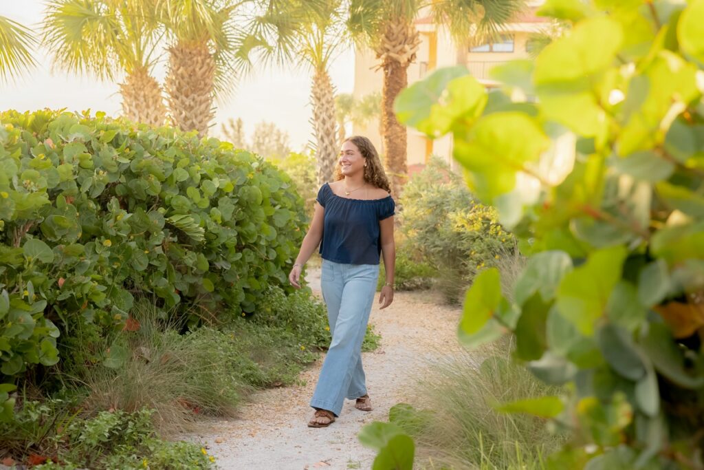 Senior girl walking through the sea grapes by Love and Style Photography, Sarasota Photographer. 