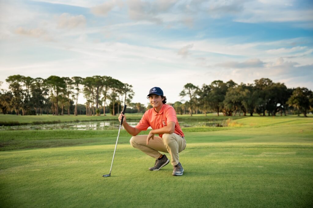 Senior boy on a Sarasota Golf course for his professional senior photos by Love & Style Photography.