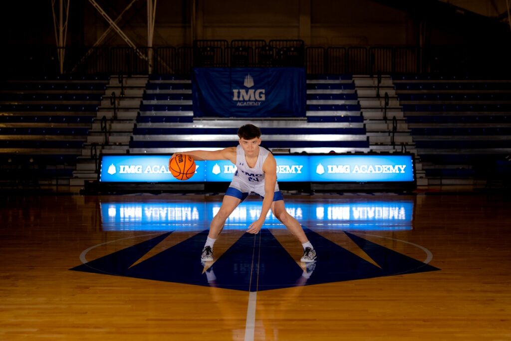 Senior Boy action shot with basketball at IMG academy.